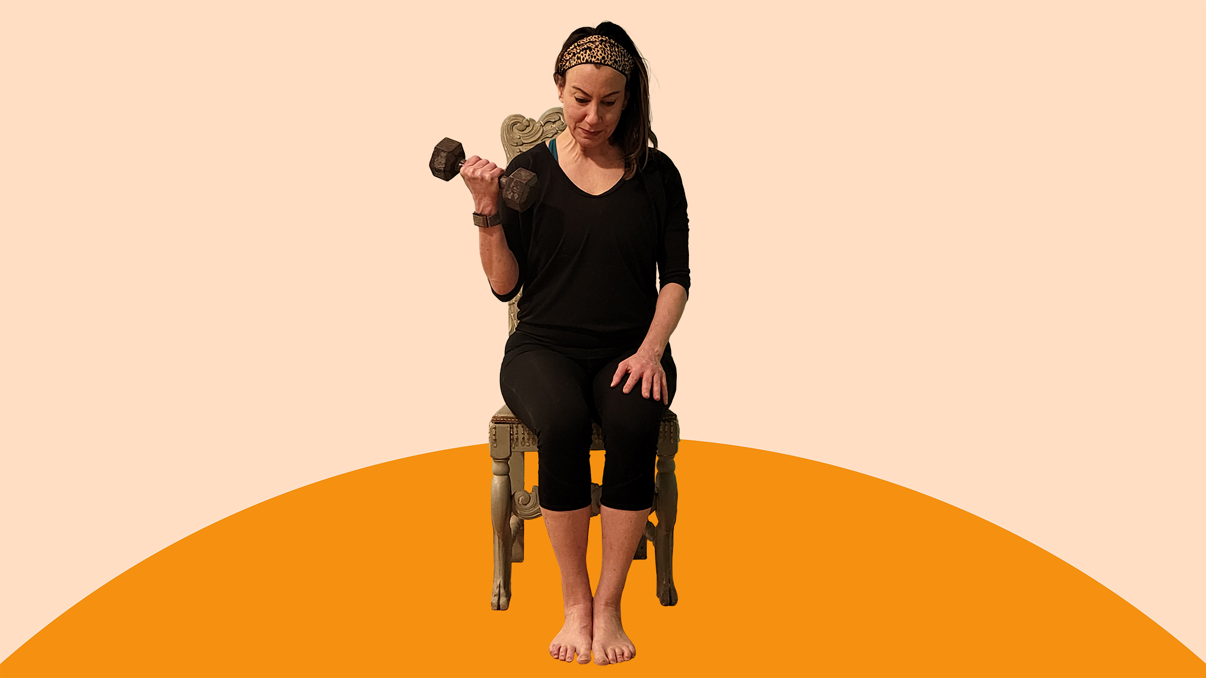 A woman does bicep curls while sitting on a chair.  
