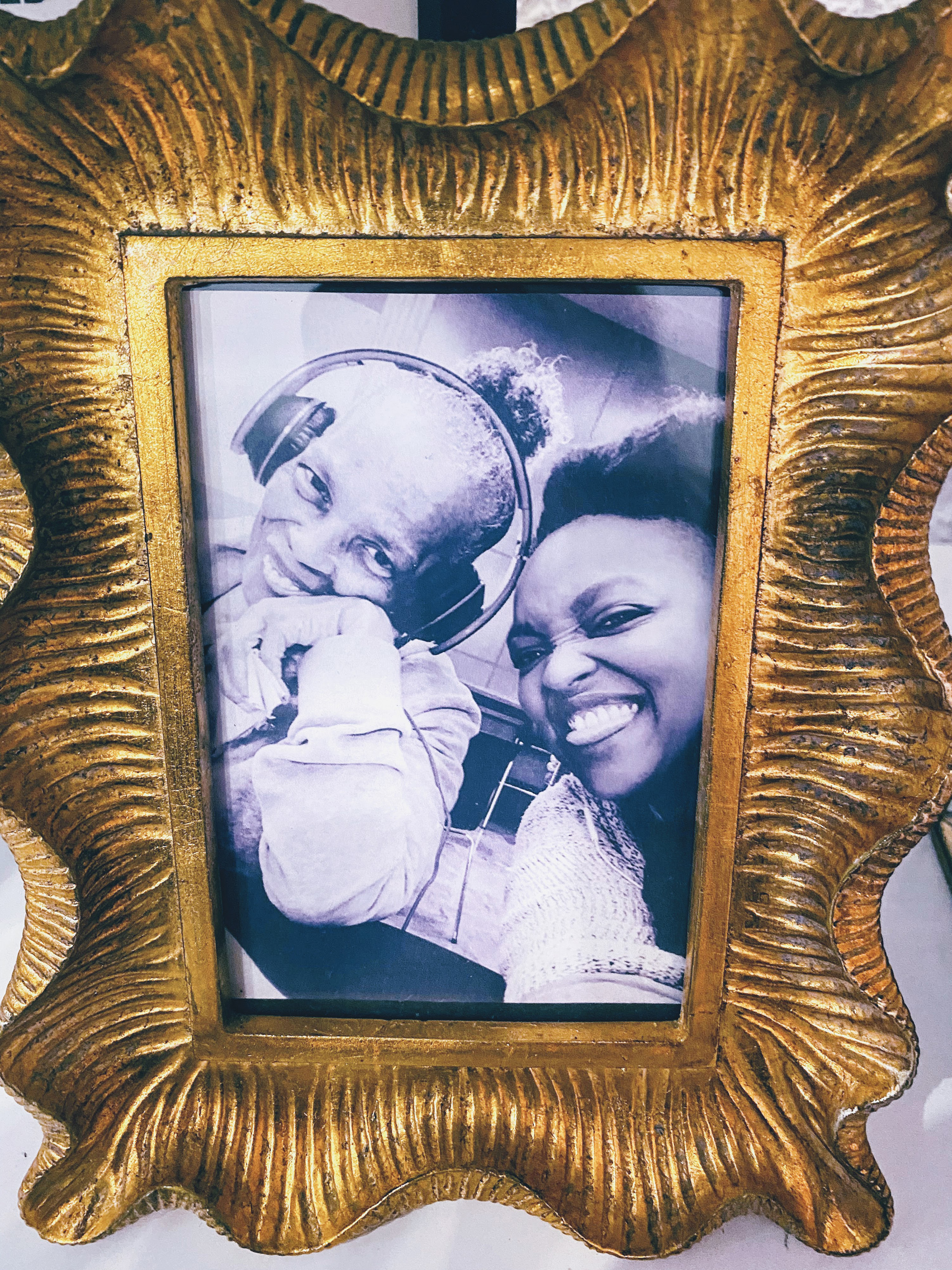 A framed photo shows Kathy Nurse, who had dementia, with her daughter and caregiver, Nikki Nurse.