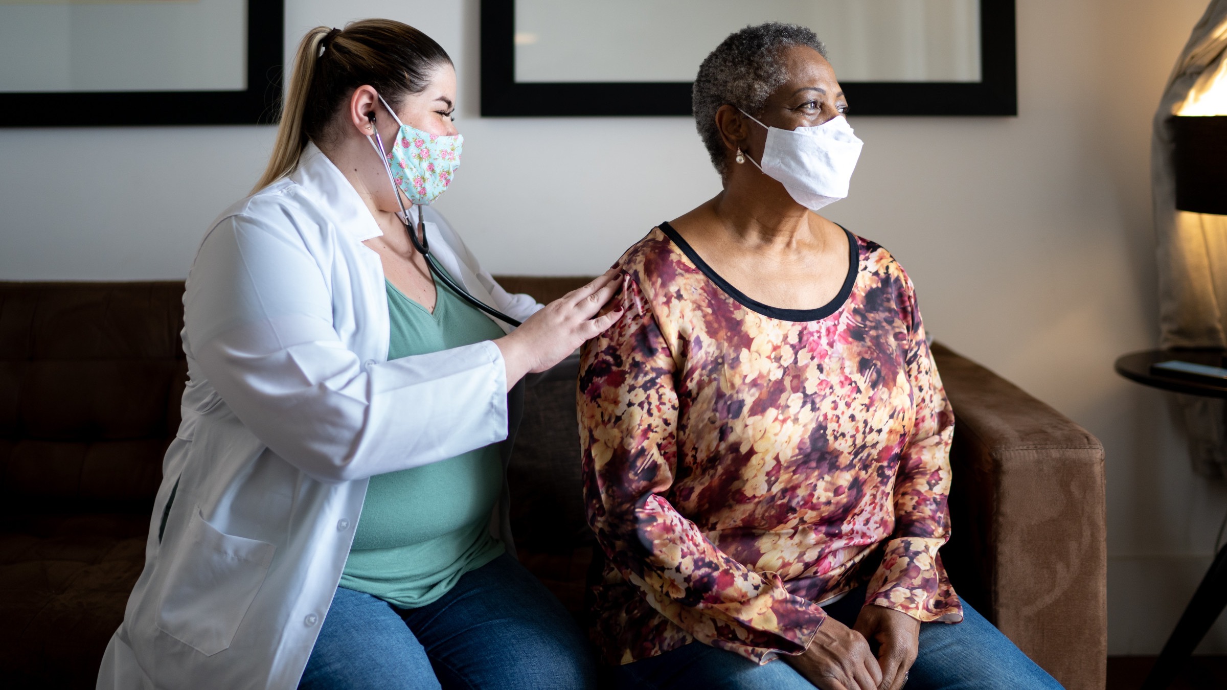 Doctor uses stethoscope to listen to patient's breathing through her back.
FG Trade/E+ via Getty Images