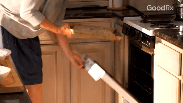Once all chicken strips are coated, place the baking sheet on the lower rack in the oven.