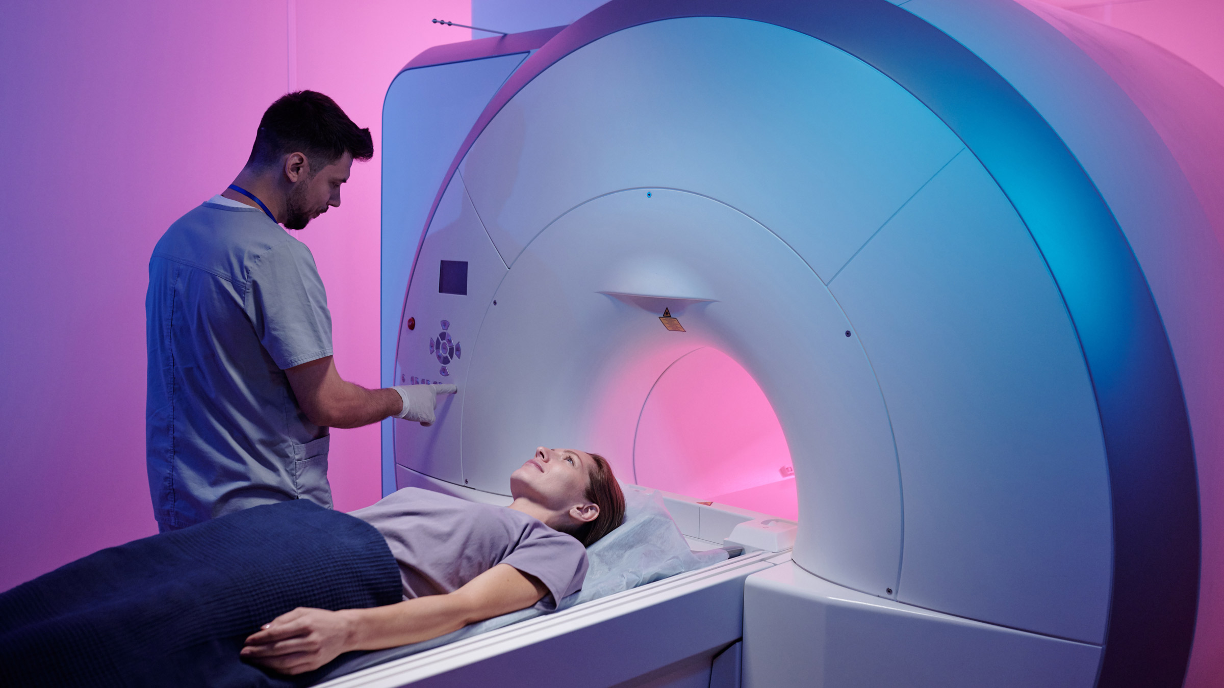 Doctor Shows The Process Of Scanning A Patient Stock Photo