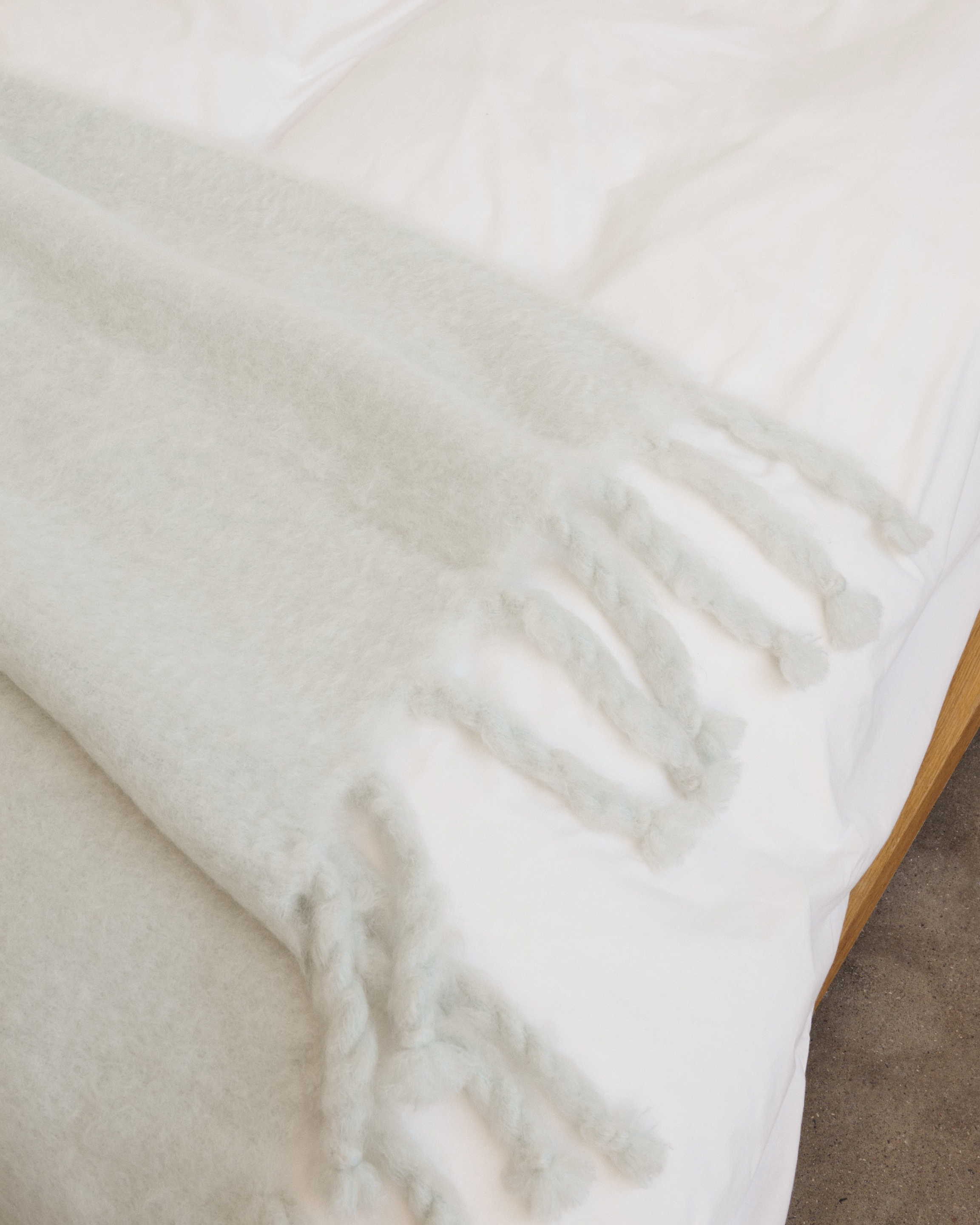 Gris mohair blanket paired with Cream White bedding