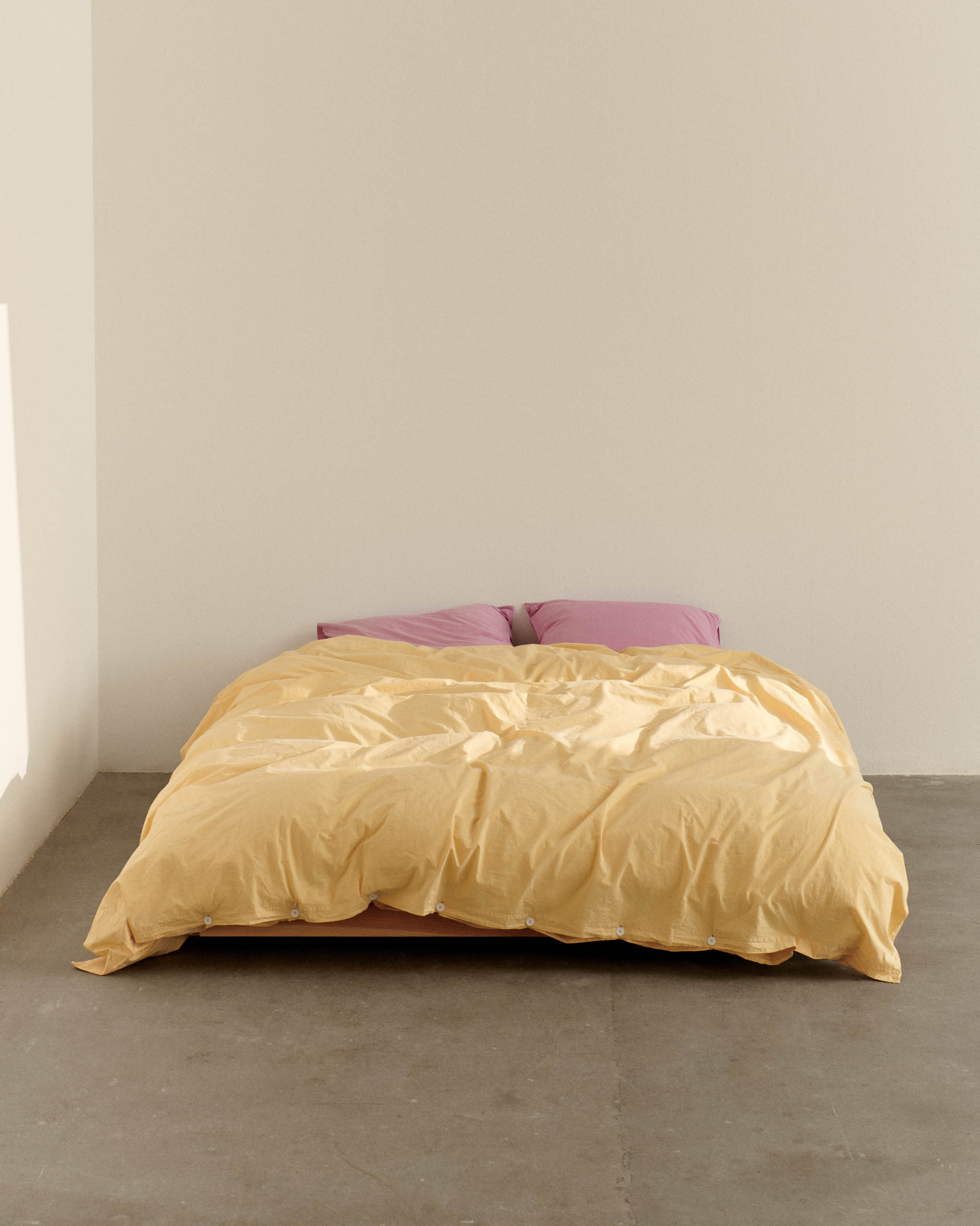 Shaded Yellow paired with Mallow Pink percale bedding