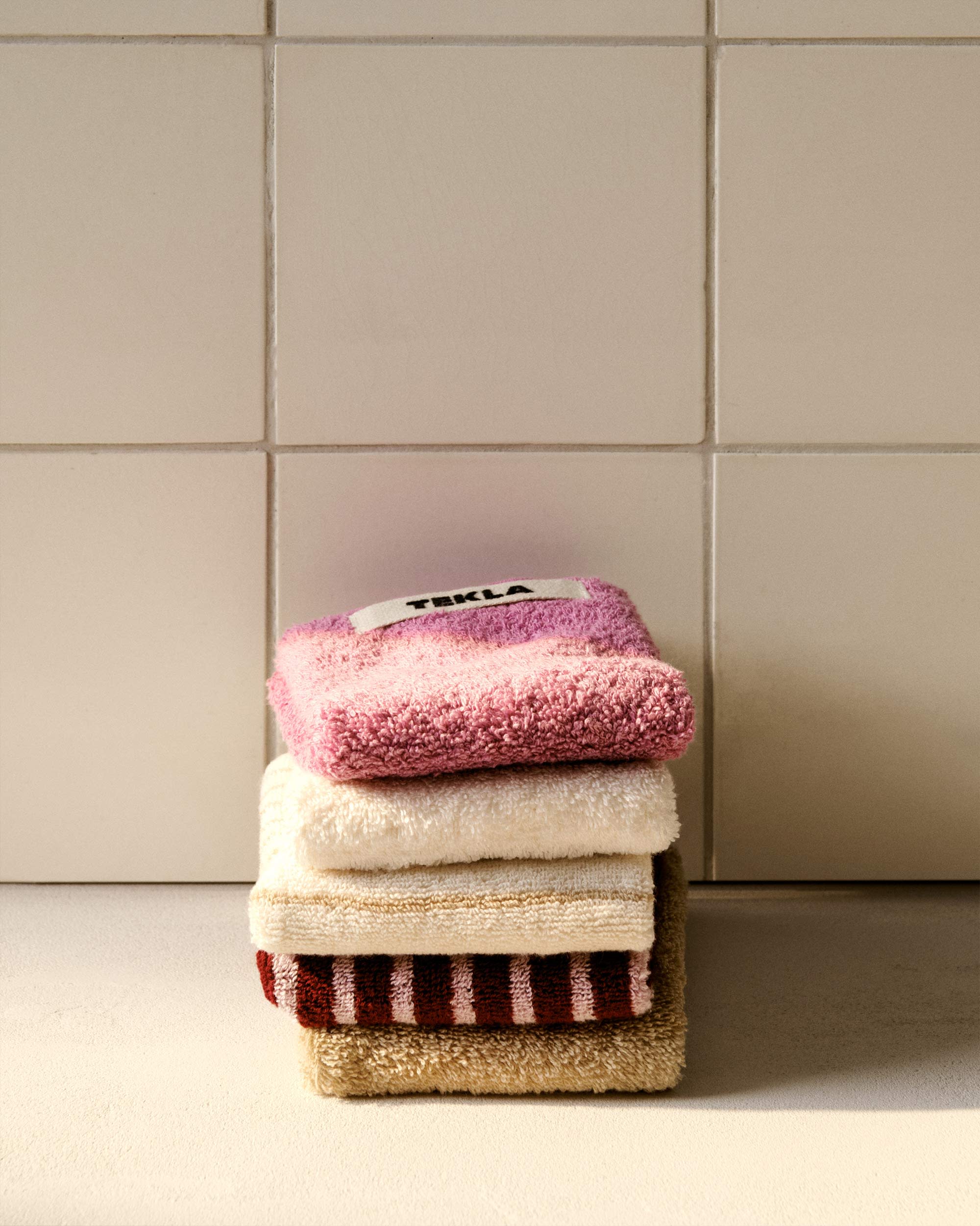 Stacked pink and white towels