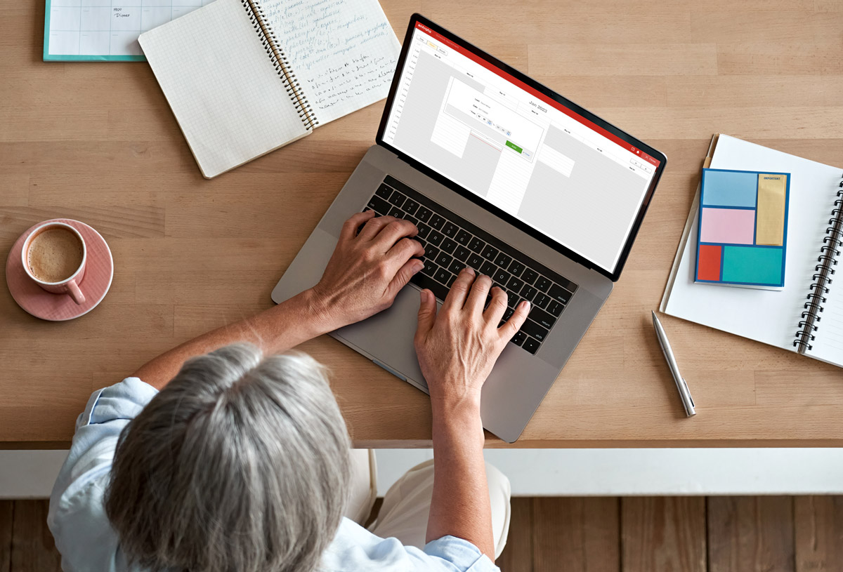 woman scheduling on computer