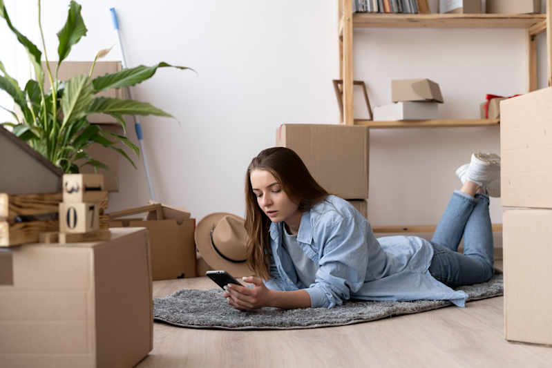 Woman on Floor Using Phone