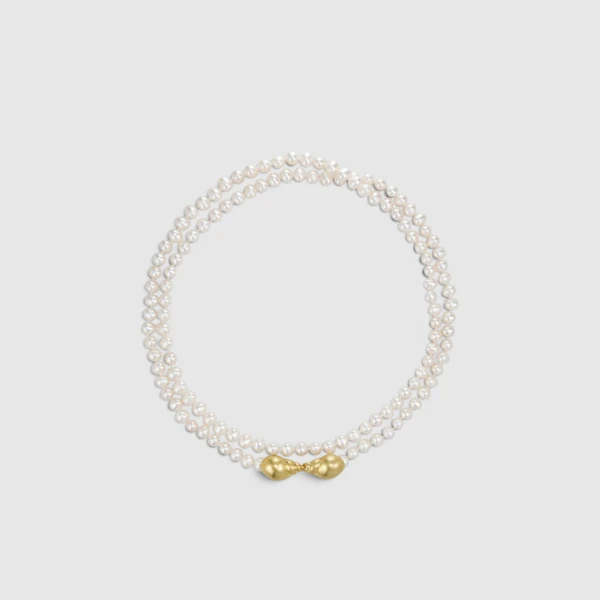 Pearl necklace with a gold knot clasp