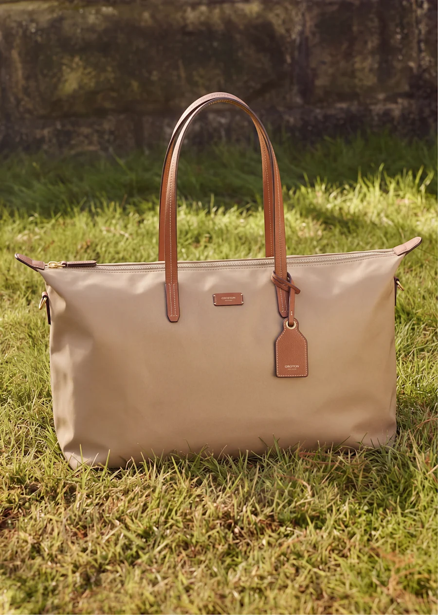 Beige tote bag on grass