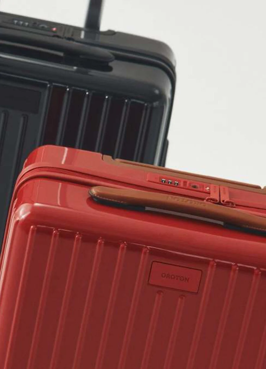 Red and black hardshell carry-on suitcases