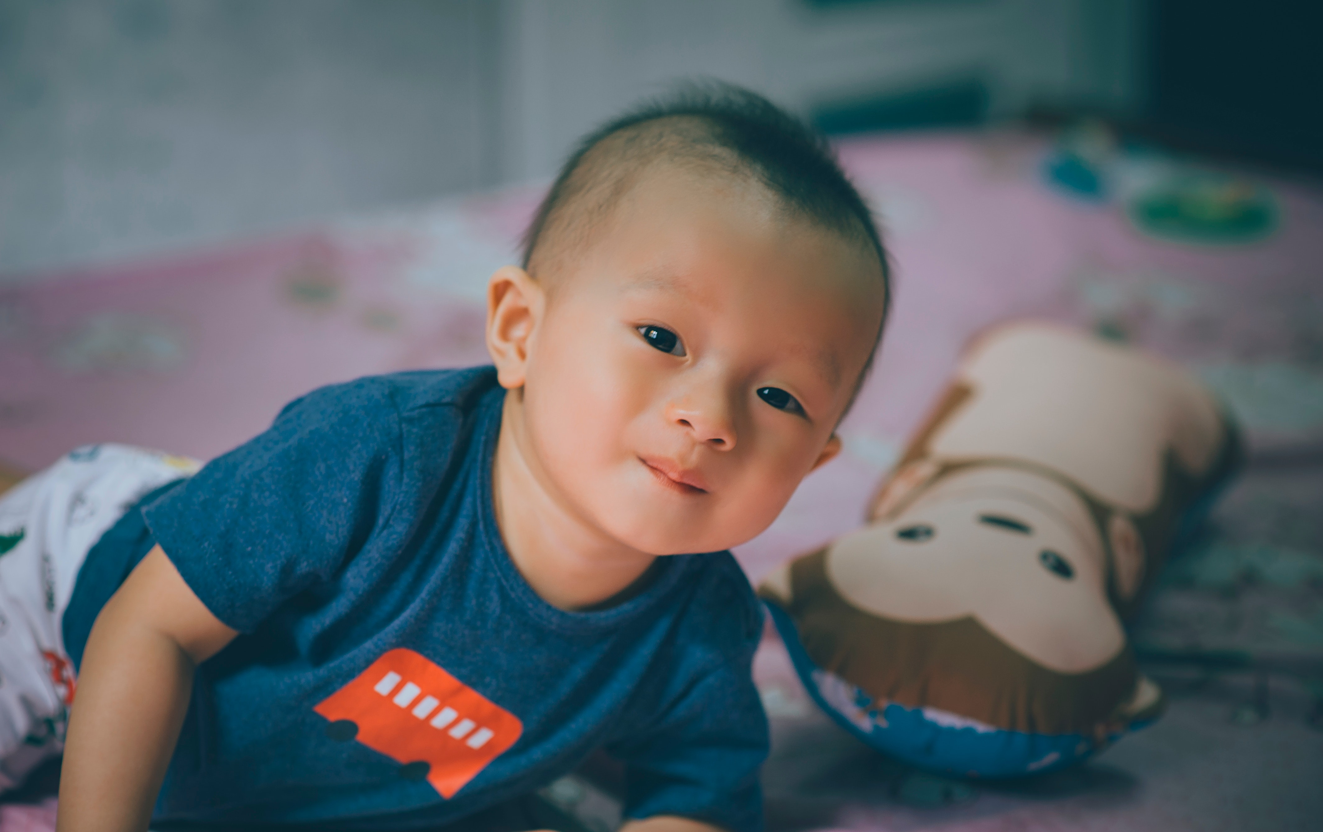 Baby on bed Photo by Min An from Pexels