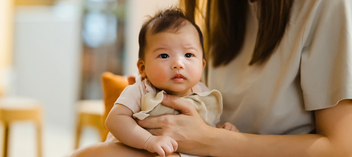 Baby being burped after feeding on demand | Huckleberry
