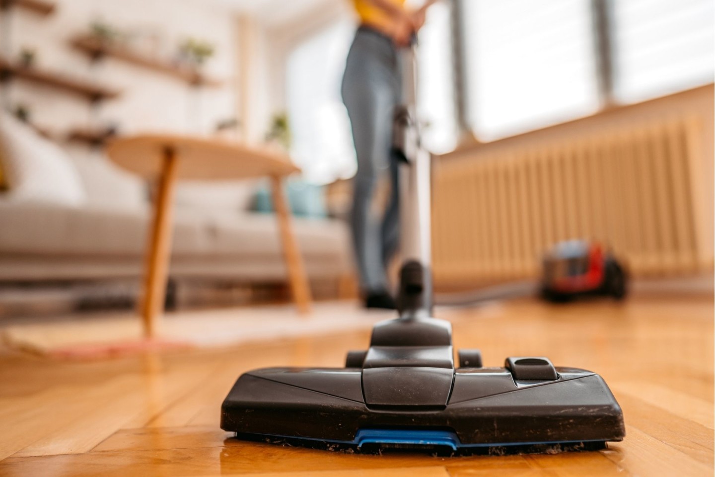 person vacuuming floor, which creates white noise
