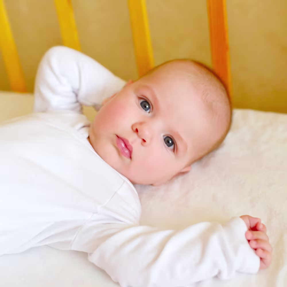 Catnapping baby in crib