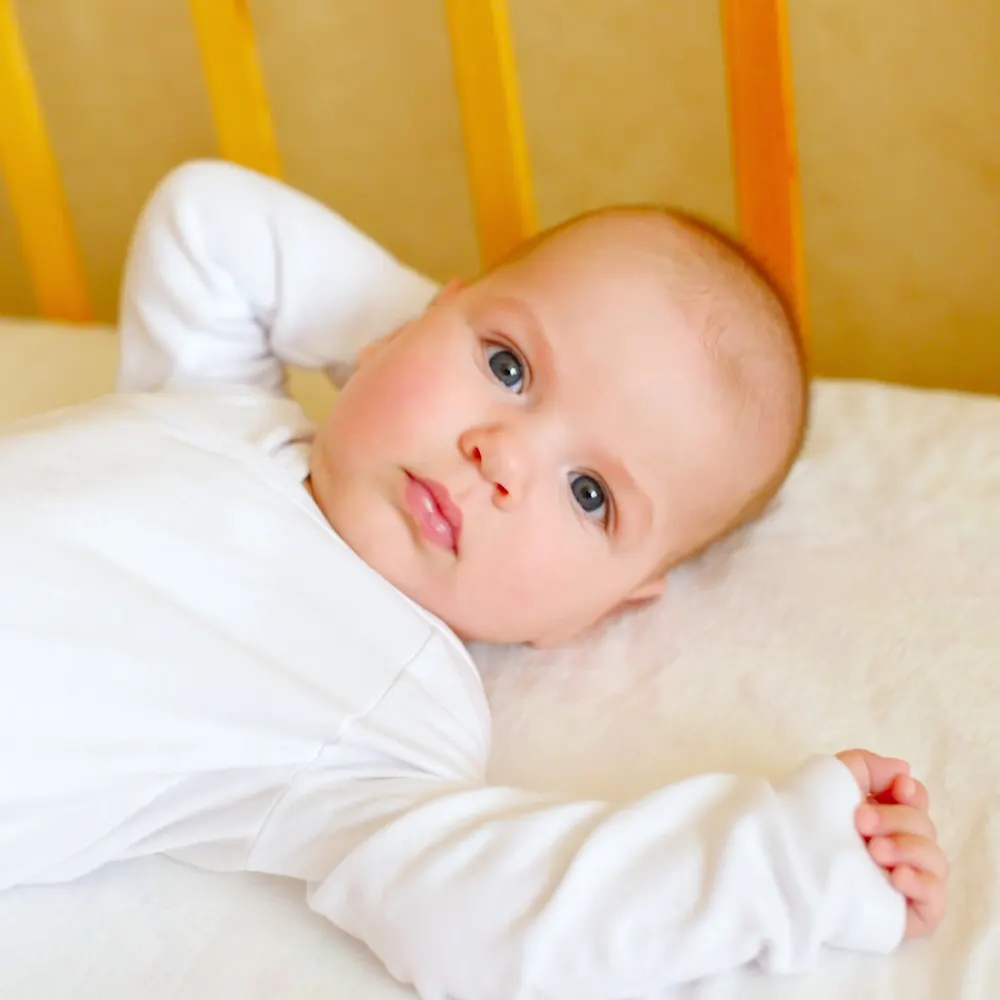 Catnapping baby in crib