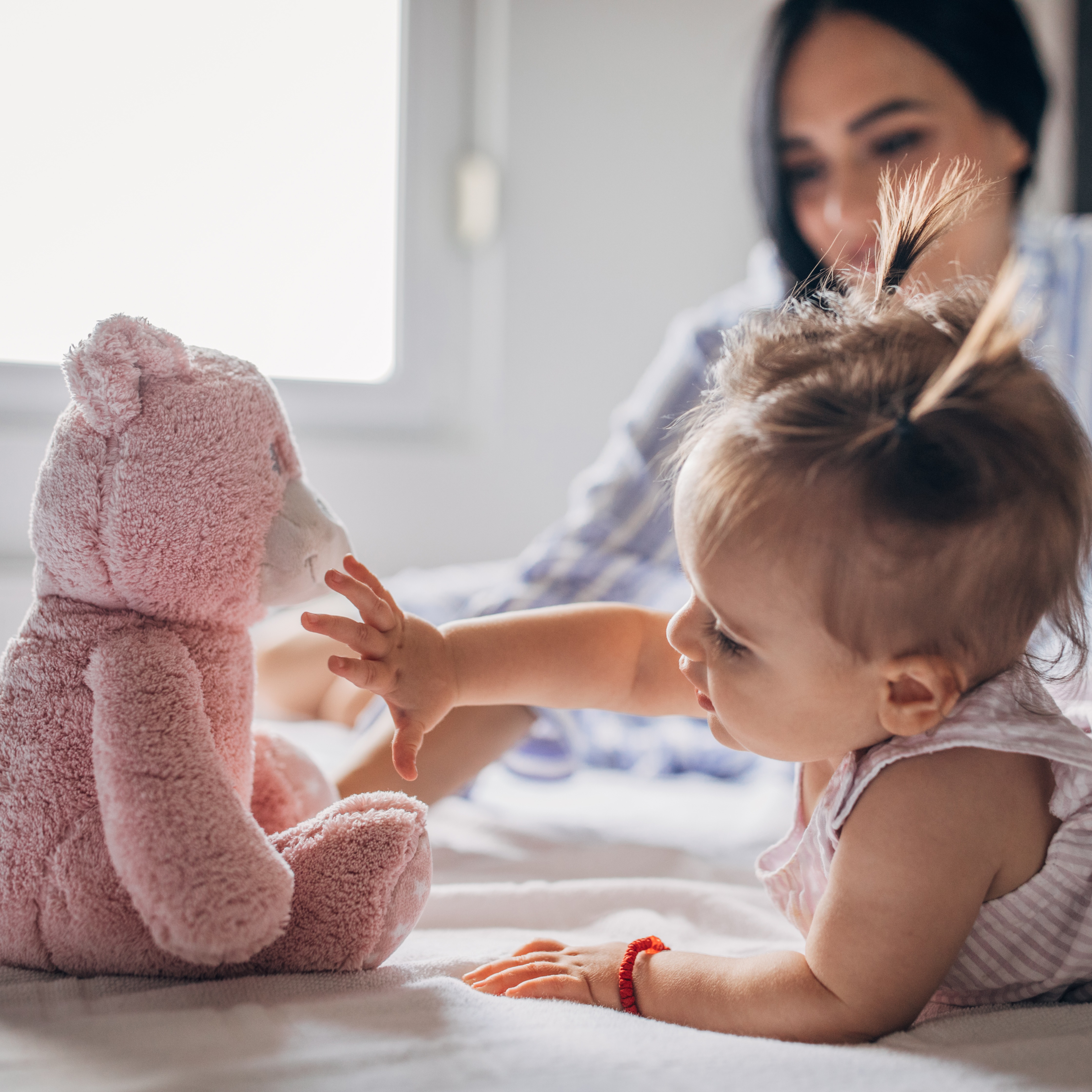 Baby girl and stuffed animal