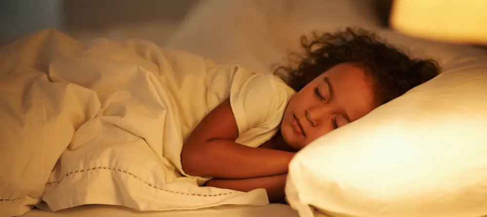A 4 year old child sleeping.