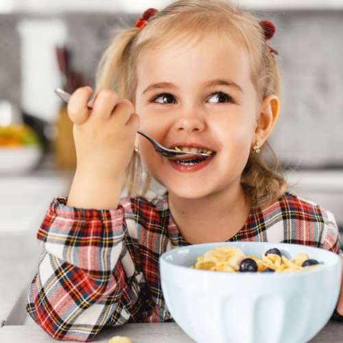 A child eating cereal.