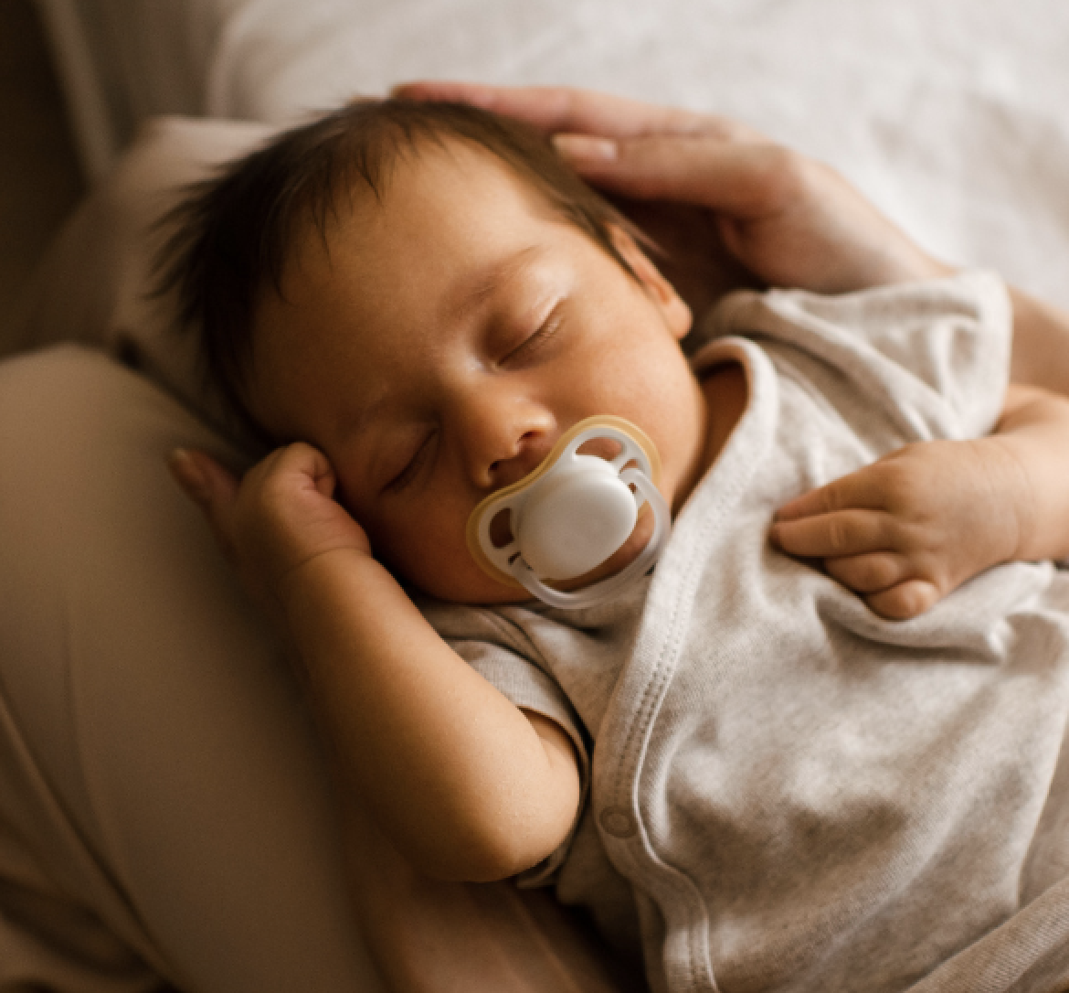 Baby asleep with a sleep consultant
