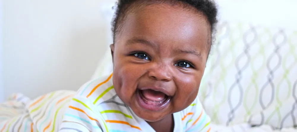 A baby laughing.