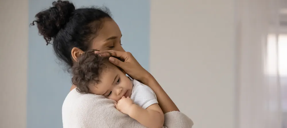 Baby separation anxiety: Baby crying while mother carries her