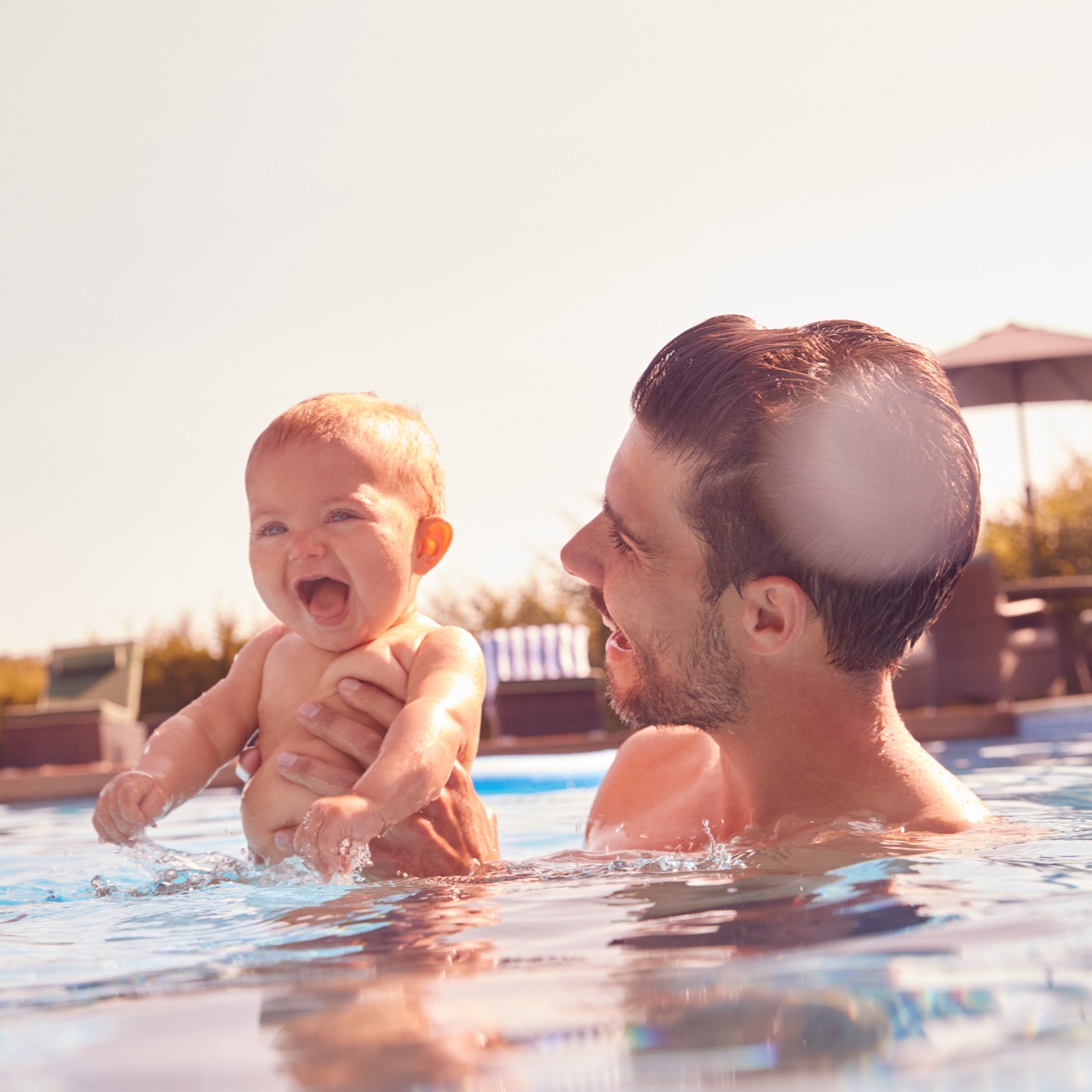 Baby and dad in the pool