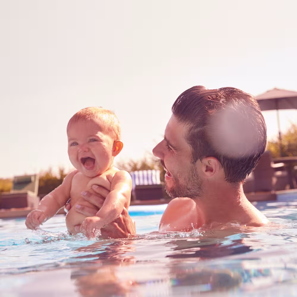 Baby and dad in the pool