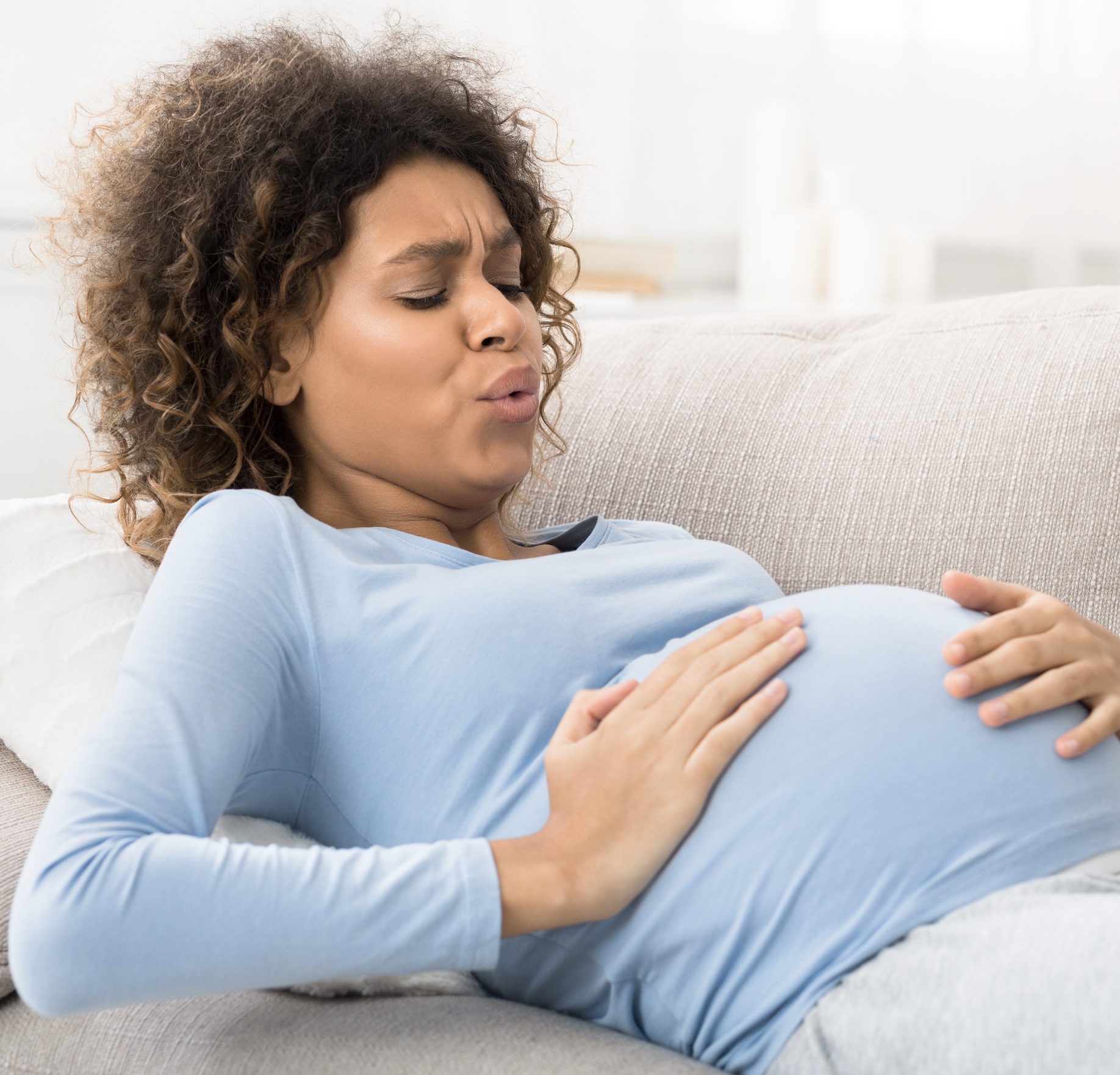 Woman having contractions while pregnant