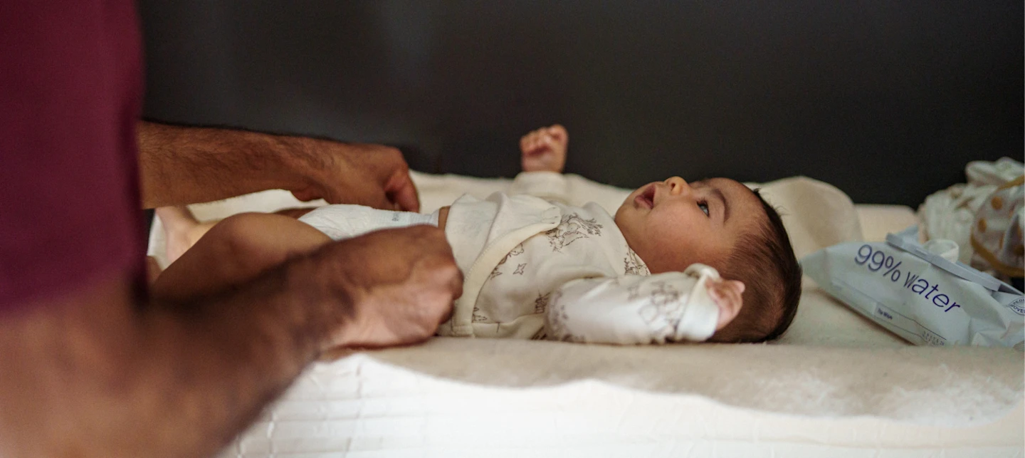 Father changing newborn baby on his night shift | Huckleberry