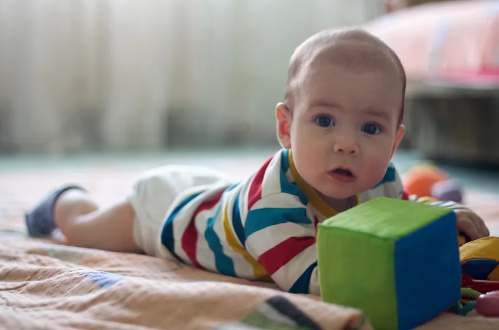 Baby playing after feeding, before sleep