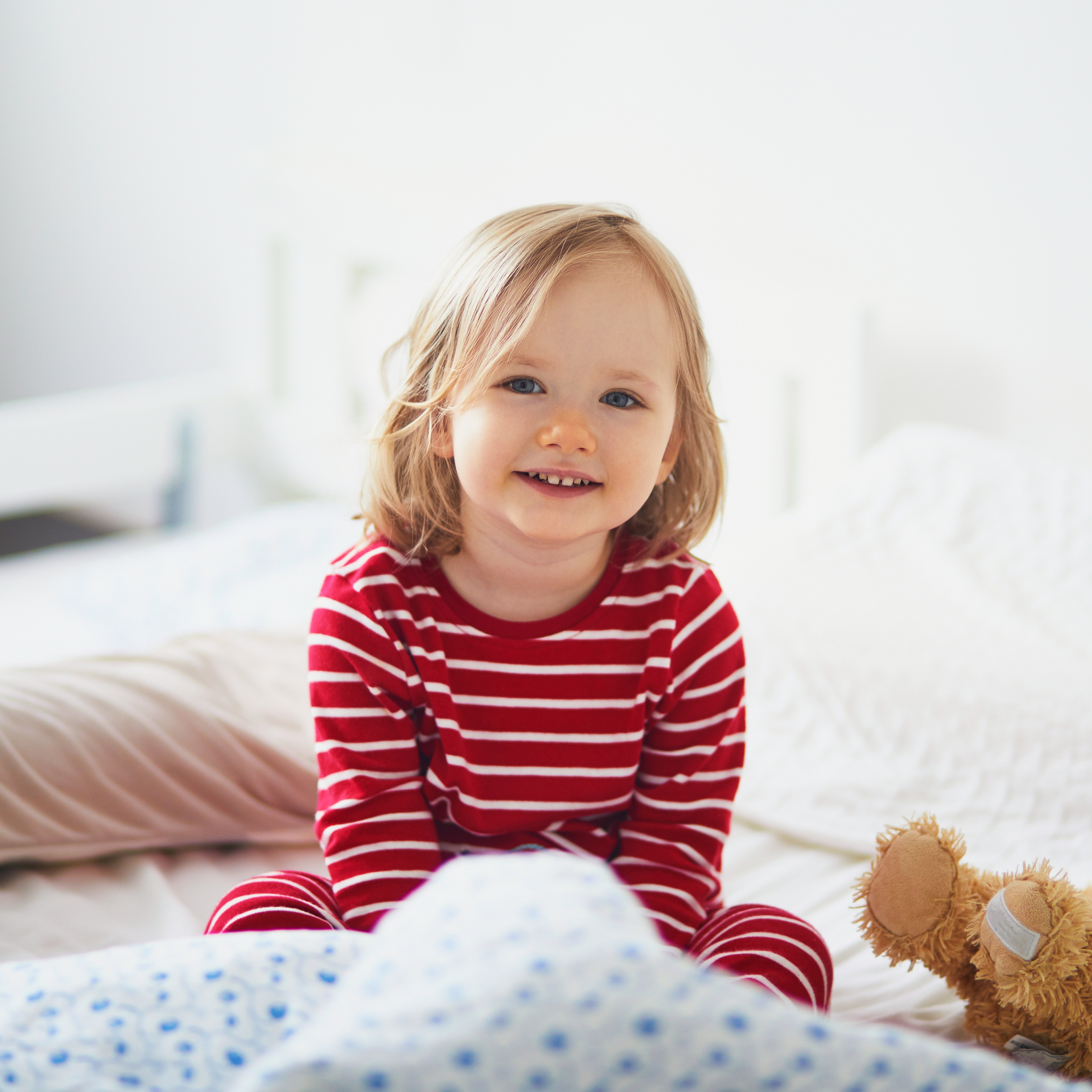 Toddler girl in bed