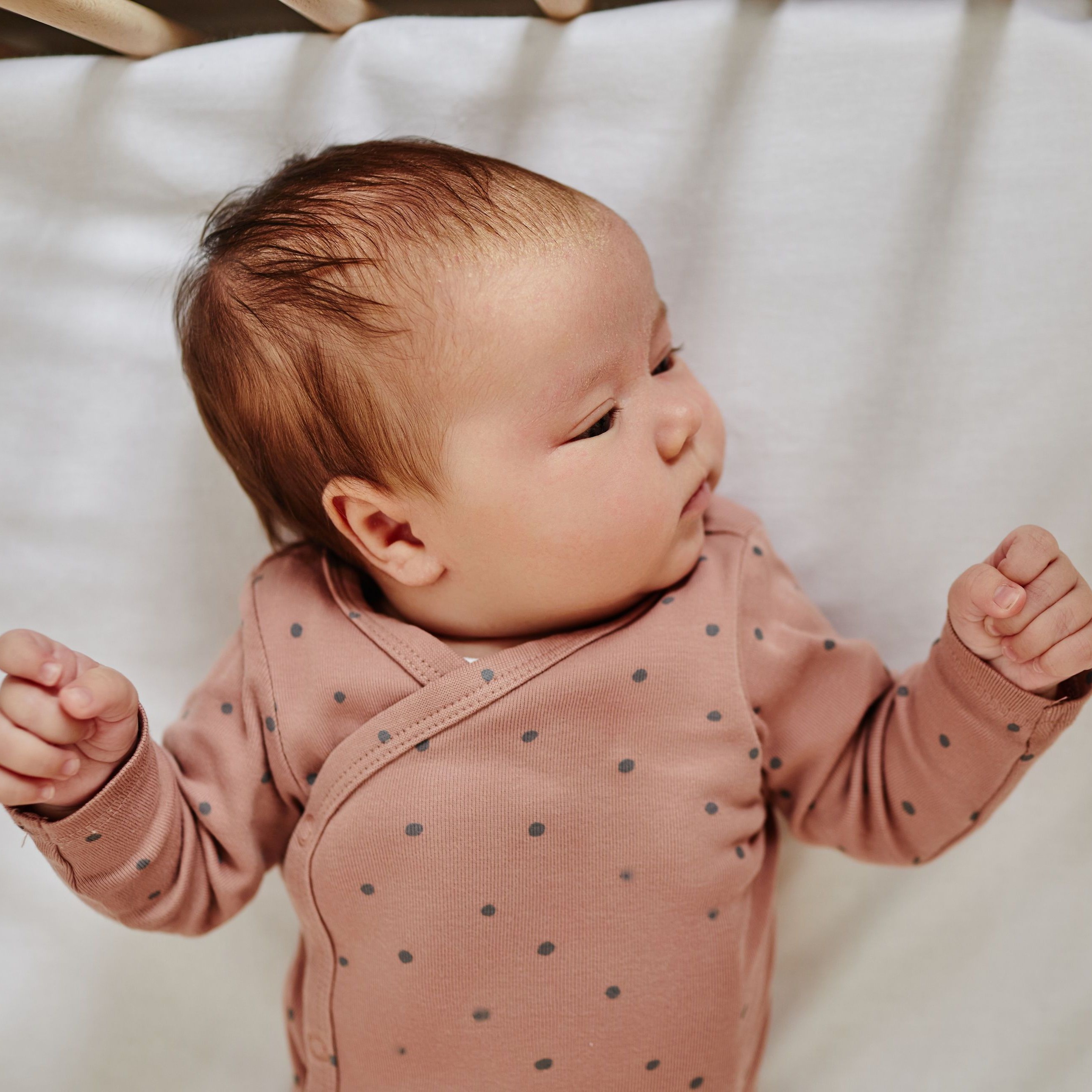 Baby waking up in crib