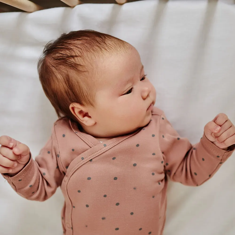 Baby waking up in crib