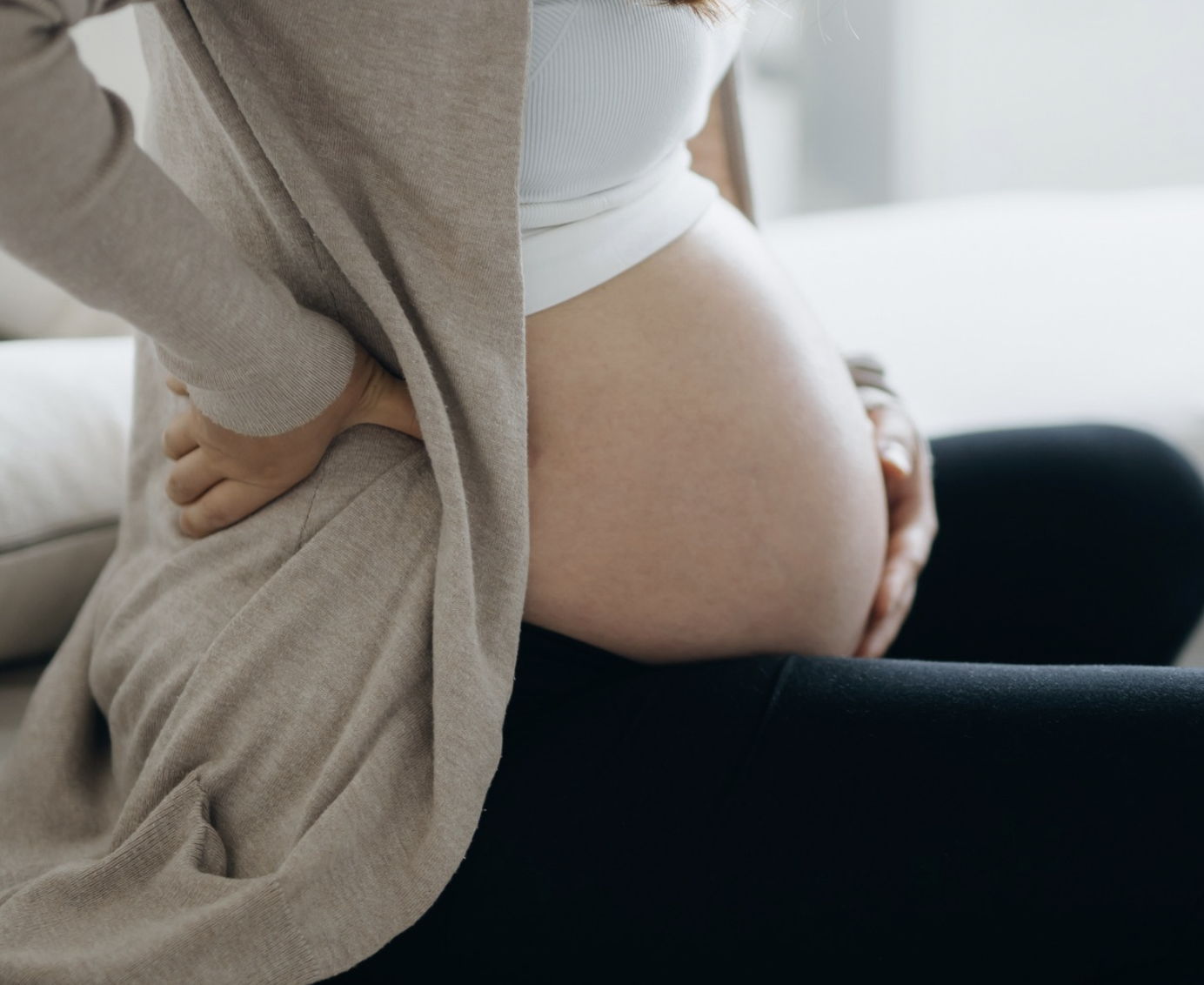 Woman holding her pregnant belly