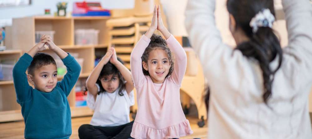 Children participating in class yoga.