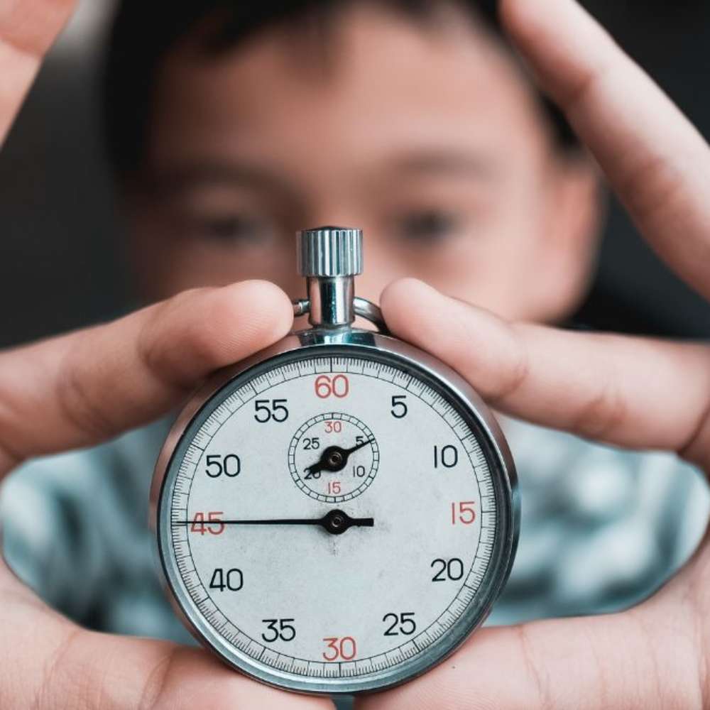 A child holding a timer.