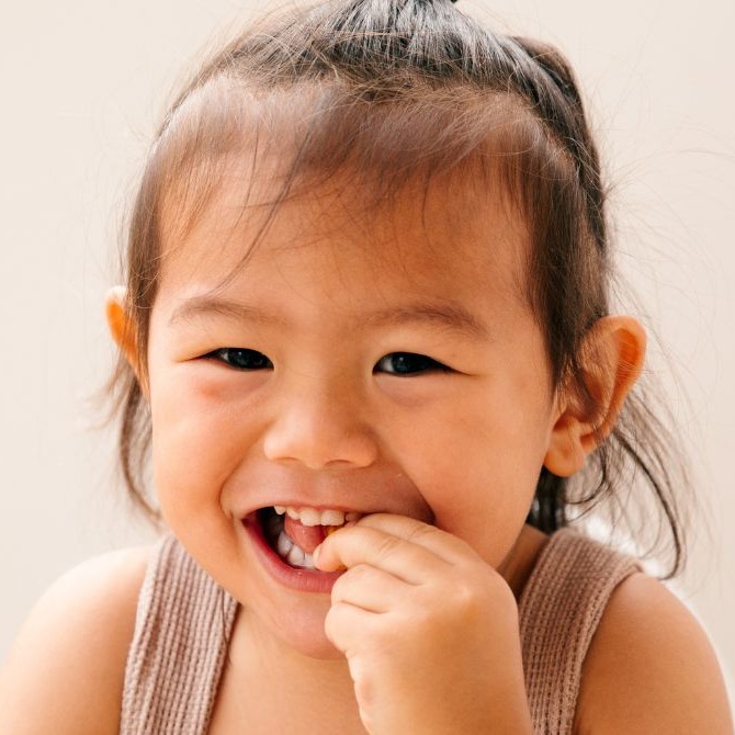 An 8 month old eating.