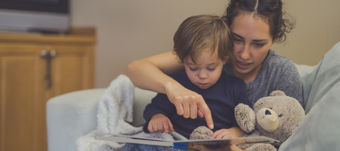 Mom reading to baby before bed time