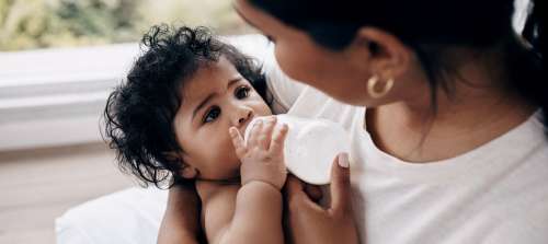A baby bottle feeding.