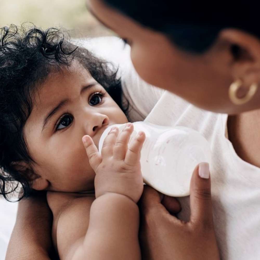 A baby bottle feeding.