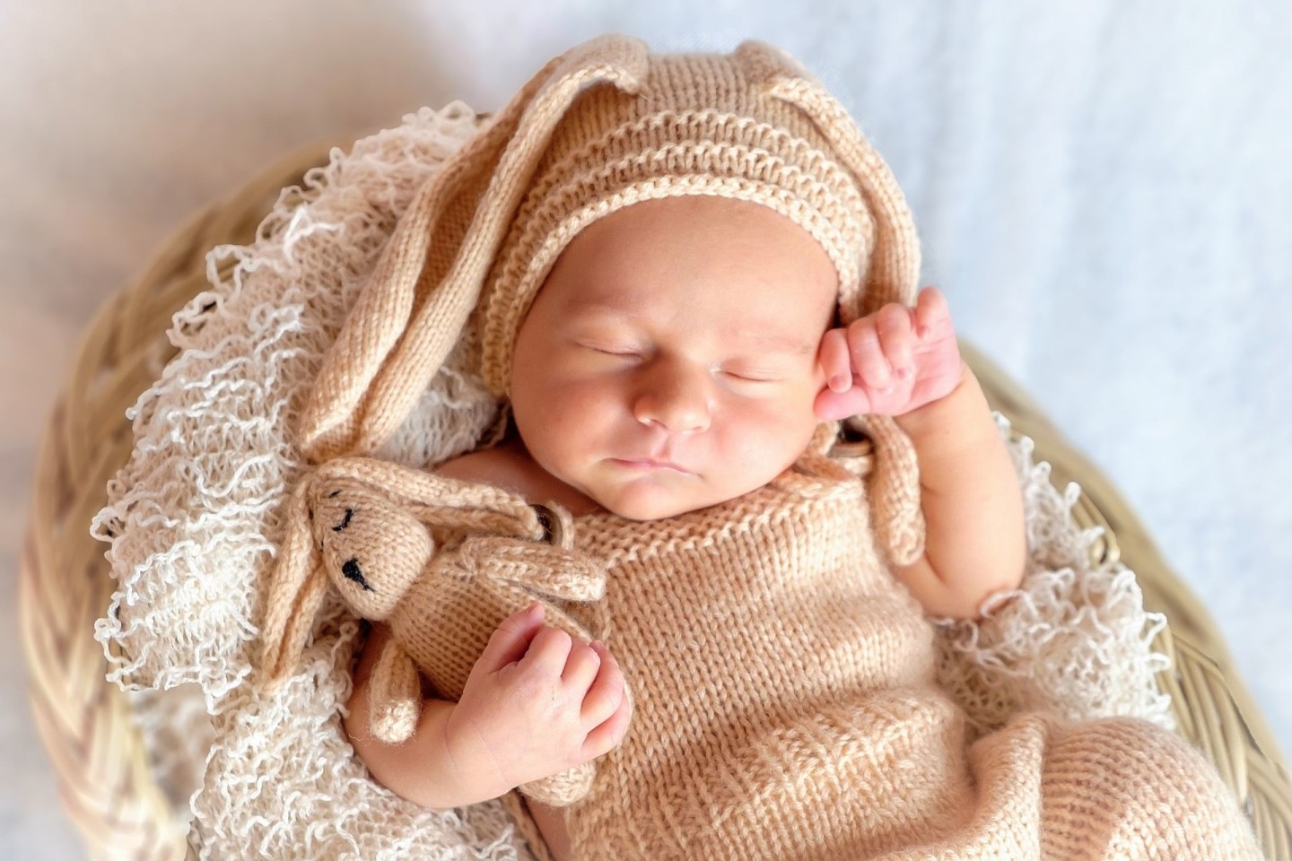 Newborn in cute outfit sleeping