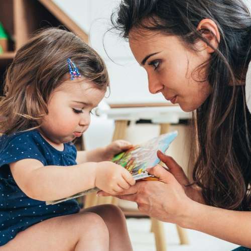 A mother talking to a child.