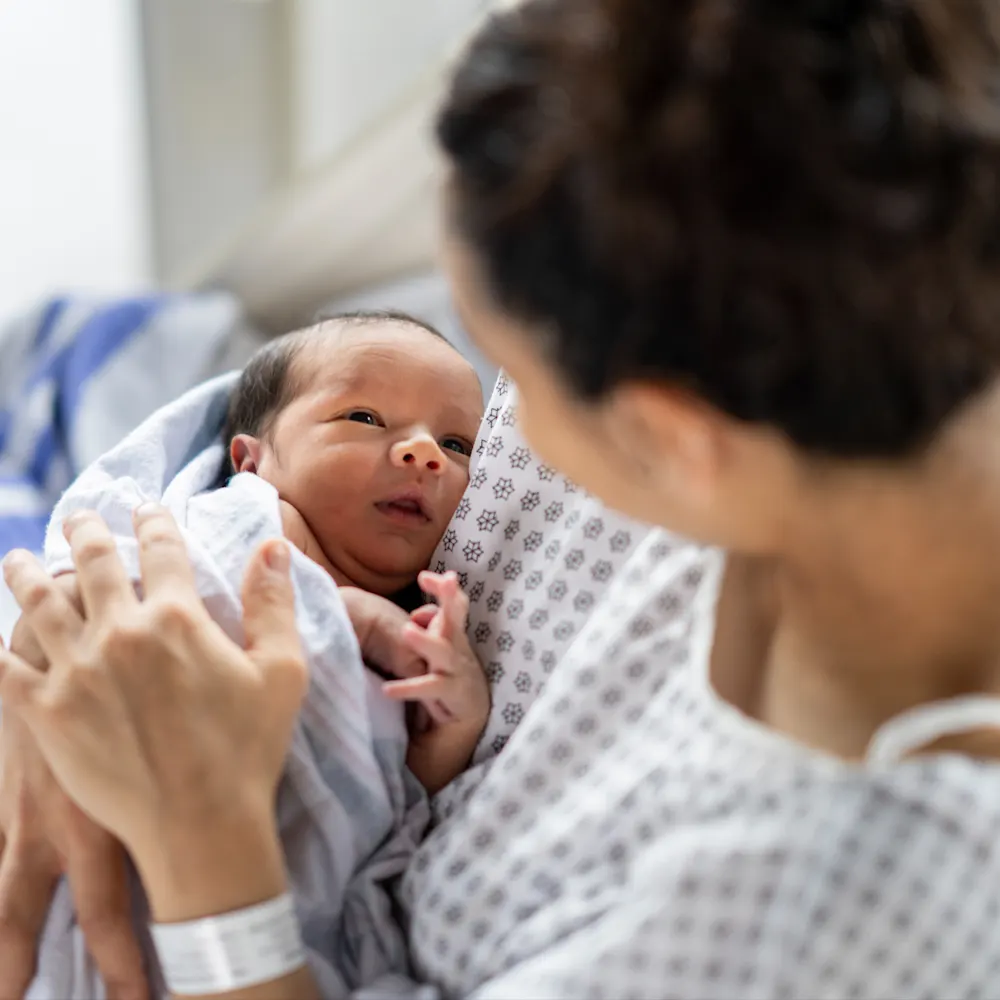 Mother bonding with baby in hospital