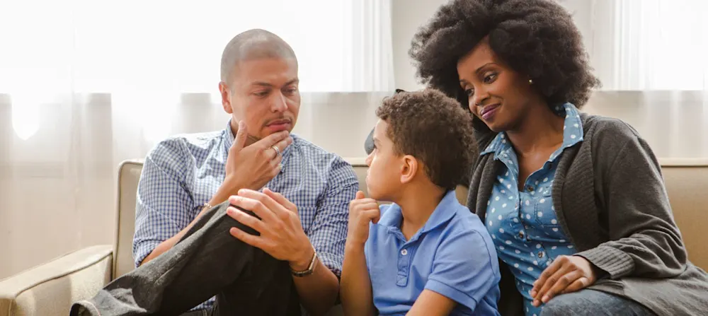 Parents talking to their child.