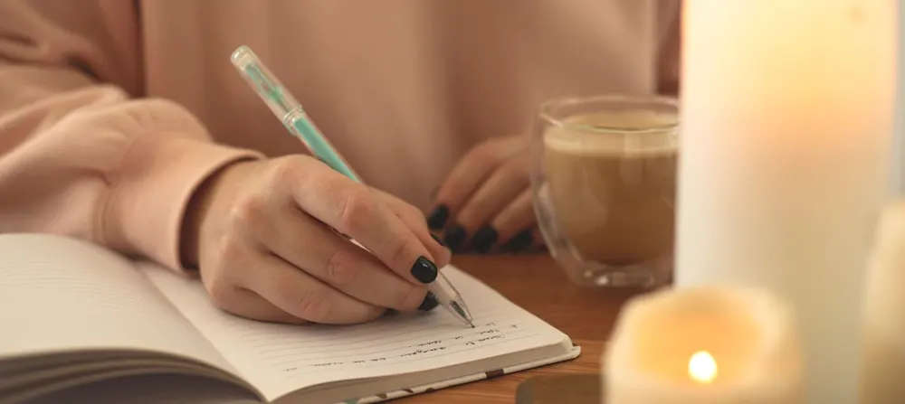 A person writing in their journal.