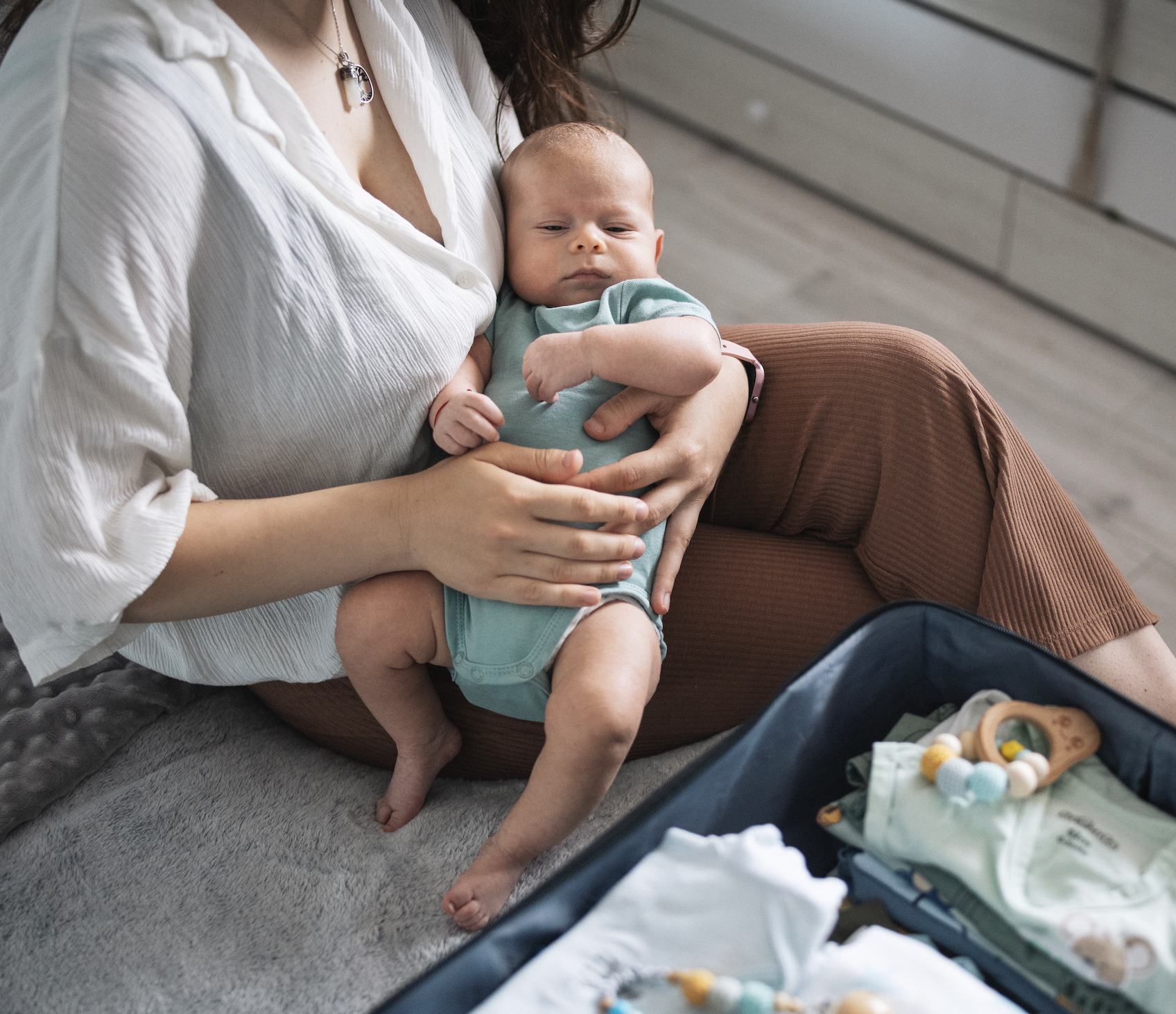 Mom and baby packing for a trip