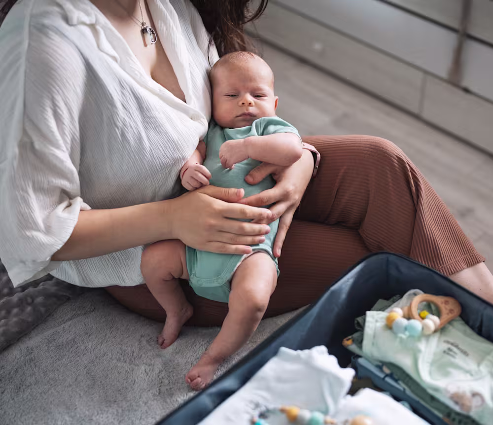 Mom and baby packing for a trip