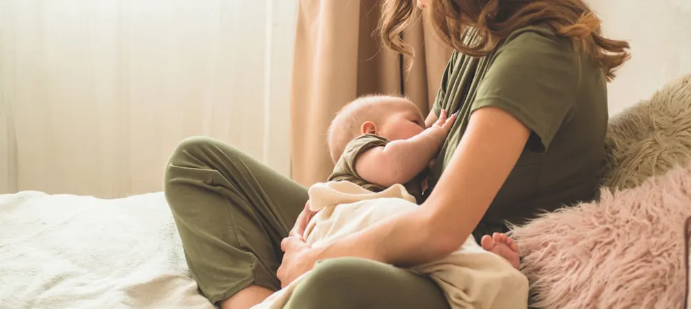 A mother breastfeeding her child.