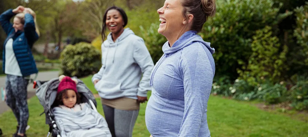 A group of women exercising outside.