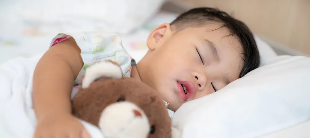 A toddler sleeping.