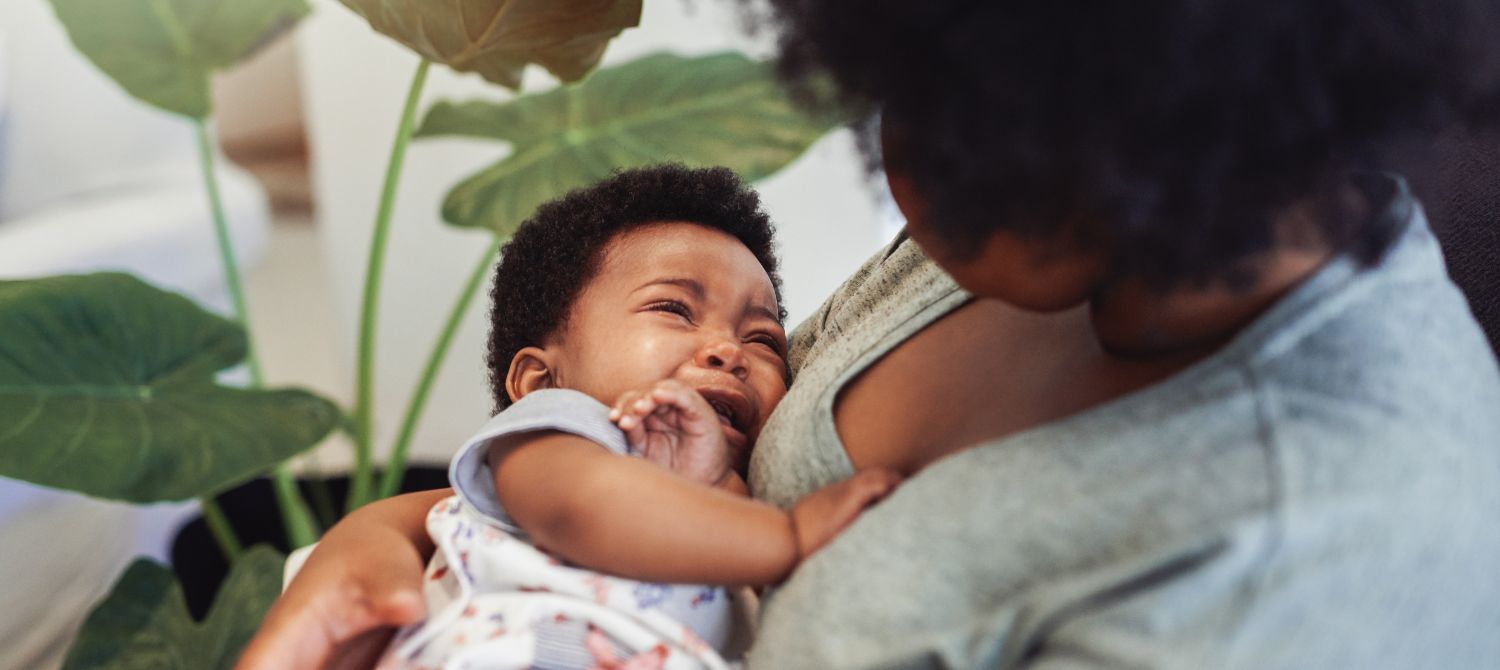 Newborn agitated hot sale while breastfeeding